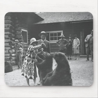 Woman feeding bears. mouse pad