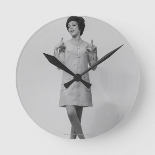 Woman Gesturing Round Clock