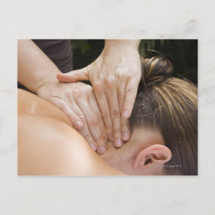 Woman getting spa treatment postcard