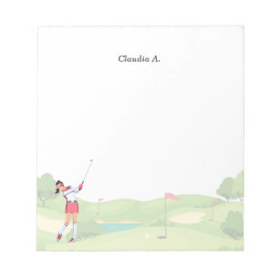 Woman golfer is golfing on the course notepad
