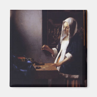 Woman Holding a Balance Magnet