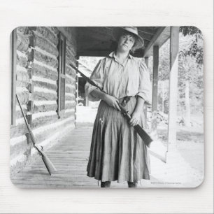 Woman holding a rifle on a porch mouse pad