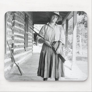 Woman holding a rifle on a porch mouse pad