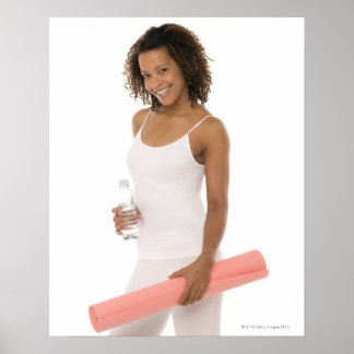 Woman holding water bottle and exercise mat poster