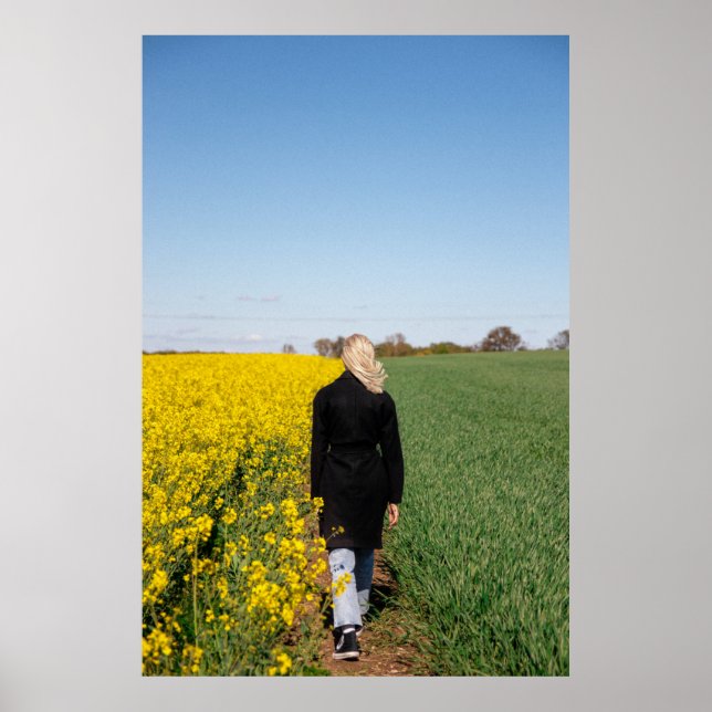 Woman in black coat standing on green grass field  poster (Front)