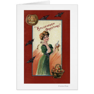 Woman in Green Dress Peeling Apple