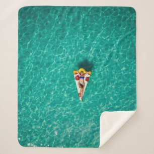 Woman in pizza float sherpa blanket