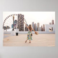 Woman in white and blue floral dress holding hat