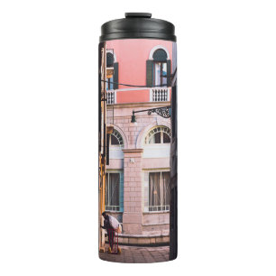 WOMAN IN WHITE SHIRT AND BLACK PANTS WALKING ON SI THERMAL TUMBLER