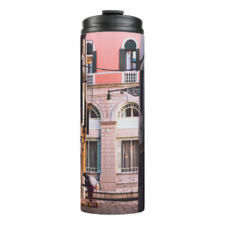 WOMAN IN WHITE SHIRT AND BLACK PANTS WALKING ON SI THERMAL TUMBLER