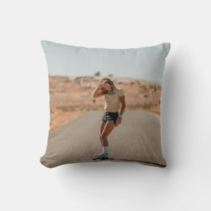 Woman in white shirt running on road in the mornin cushion