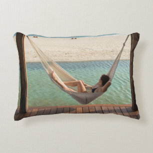 Woman Laying On A Hammock At A Small Hotel Decorative Cushion