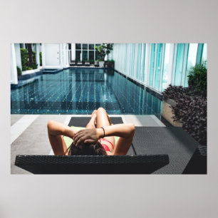 Woman laying on brown chaise lounge poster