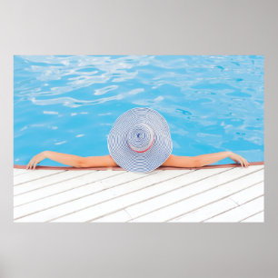 Woman leaning on white concrete surface beside swi poster