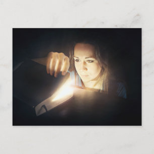 Woman Looks Inside a Glowing Book Postcard