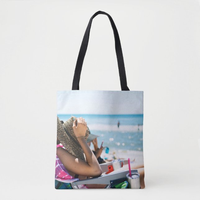 Woman lying on sun lounger covering her face with  tote bag (Front)