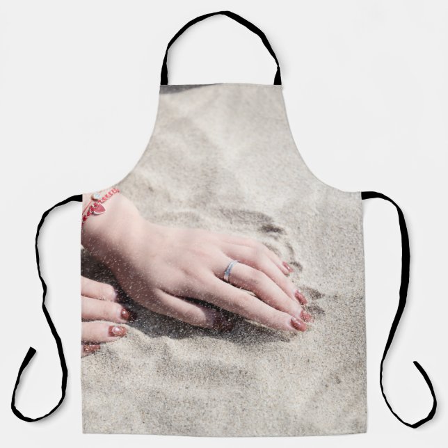 Woman lying on white sand apron (Front)