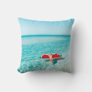 Woman on lilo in the sea water. Girl relaxing on i Cushion
