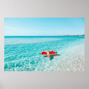 Woman on lilo in the sea water. Girl relaxing on i Poster