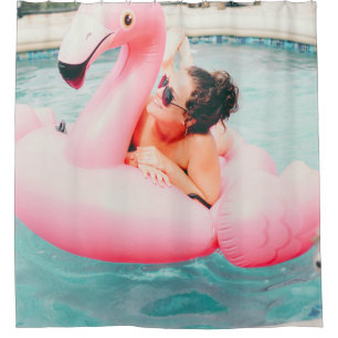 Woman on pink inflatable flamingo on outdoor pool shower curtain