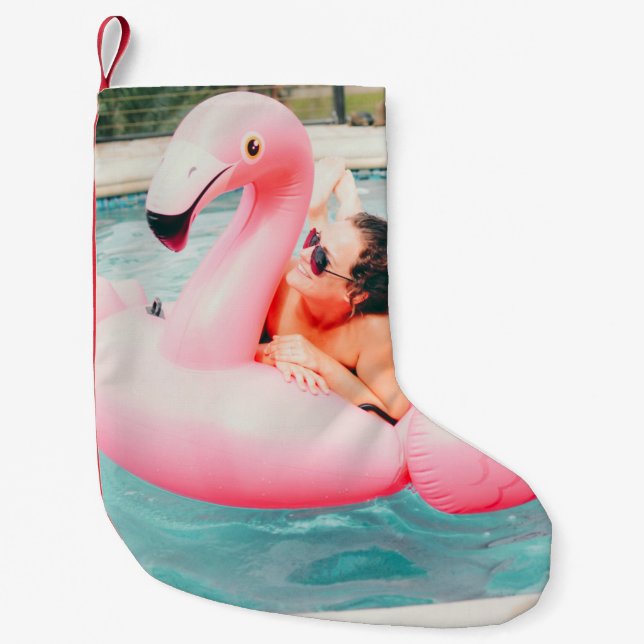 Woman on pink inflatable flamingo on outdoor pool small christmas stocking (Front)