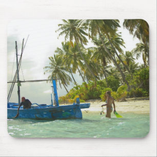 Woman on small traditional fishing boat, mouse pad