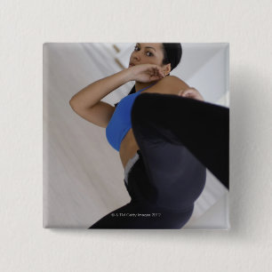 Woman performing martial arts 15 cm square badge