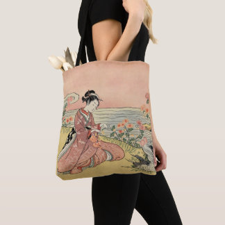 Woman picking chrysanthemums tote bag