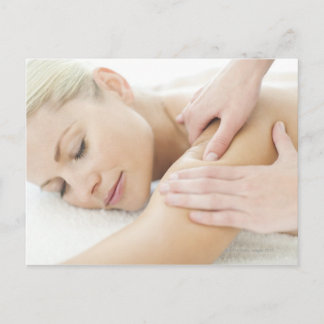 Woman relaxing at a spa while receiving a 2 postcard