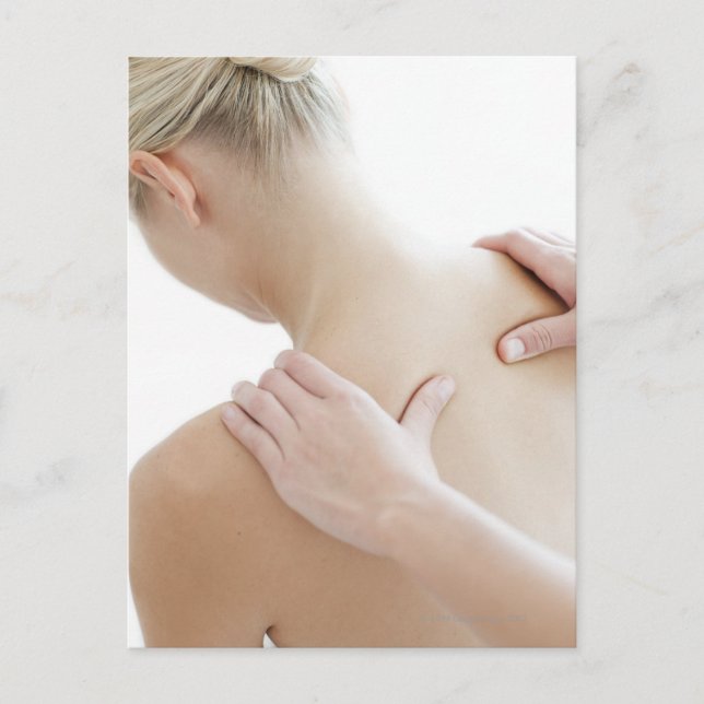 Woman relaxing at a spa while receiving a postcard (Front)