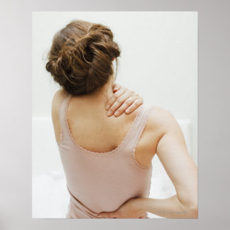 Woman rubbing aching back poster