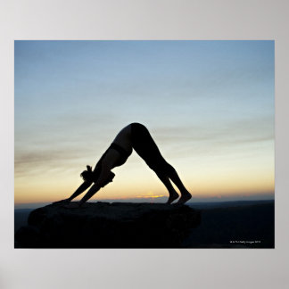 woman silhouetted against the sunset practicing poster