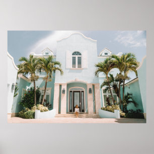 Woman sitting in front of building poster