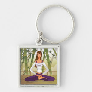 Woman sitting in lotus position, meditating key ring
