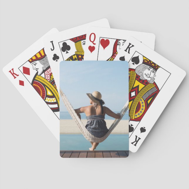Woman Sitting On A Hammock At A Small Hotel Playing Cards (Back)