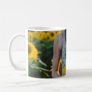 Woman standing at sunflower field coffee mug