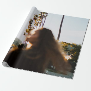 Woman standing near outdoor in the morning wrapping paper