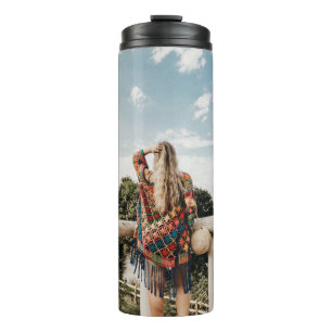 Woman standing on terrace thermal tumbler