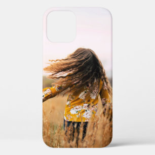 Woman walking on field at daytime iPhone 12 case