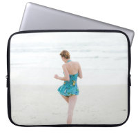 Woman walking on shore near beach