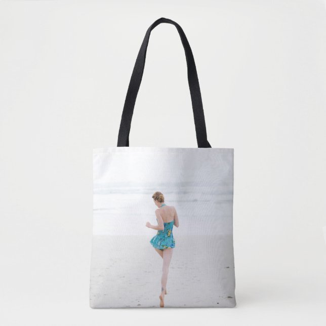 Woman walking on shore near beach tote bag (Front)
