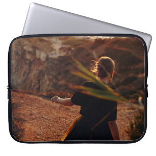 Woman walking on stone laptop sleeve