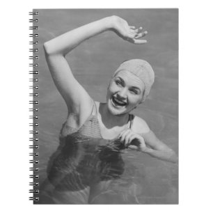 Woman Waving Notebook