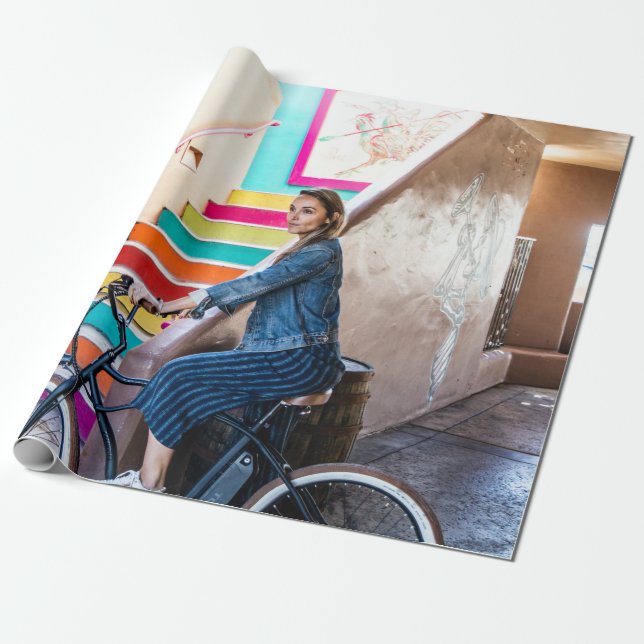 Woman wearing blue denim jacket and shorts riding  wrapping paper (Unrolled)