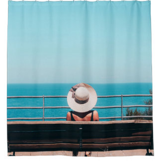 Woman wearing white straw hat sitting on bench loo shower curtain