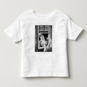 Woman wringing washing toddler T-Shirt