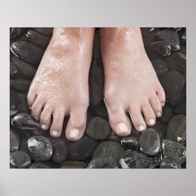 Woman's feet on pebbles poster (Front)
