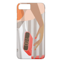 Womans hand pushing on alarm clock snooze button