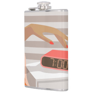 Womans hand pushing on alarm clock snooze button hip flask