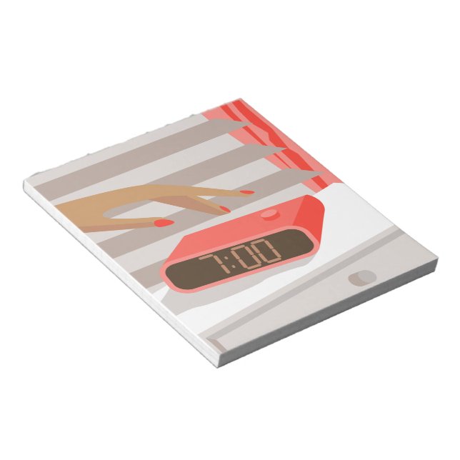 Womans hand pushing on alarm clock snooze button notepad (Angled)
